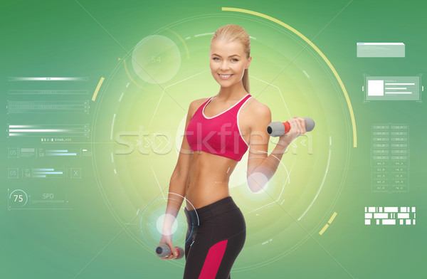 Stock photo: happy sporty woman with dumbbells flexing biceps