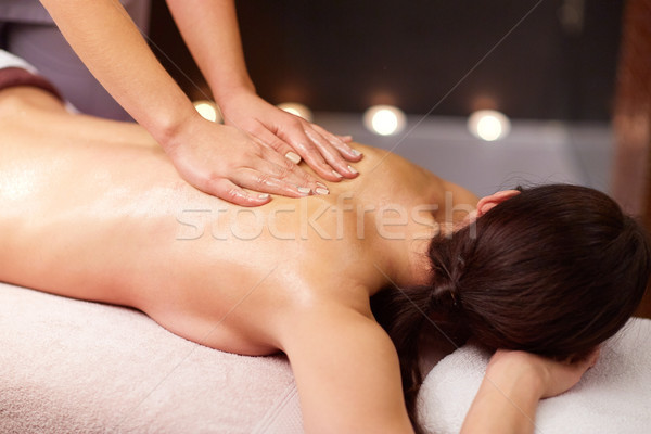 woman having back massage with gel at spa Stock photo © dolgachov