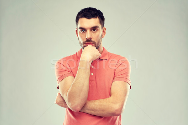 man thinking over gray background Stock photo © dolgachov