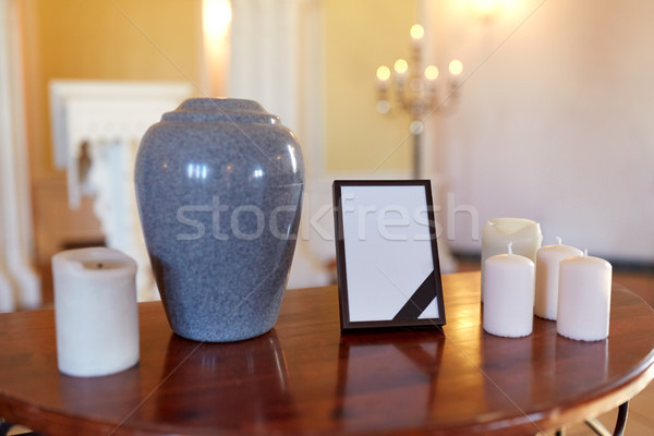 photo frame, cremation urn and candles in church Stock photo © dolgachov