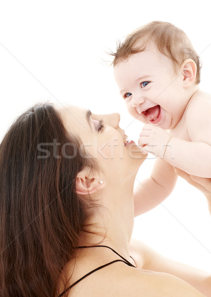 laughing blue-eyed baby playing with mom Stock photo © dolgachov
