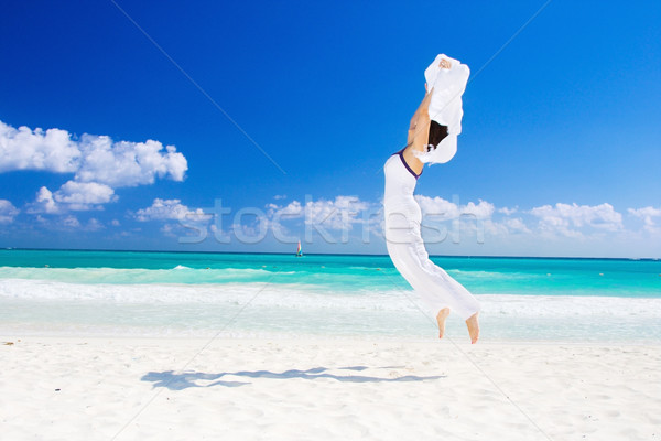 happy woman with white sarong Stock photo © dolgachov