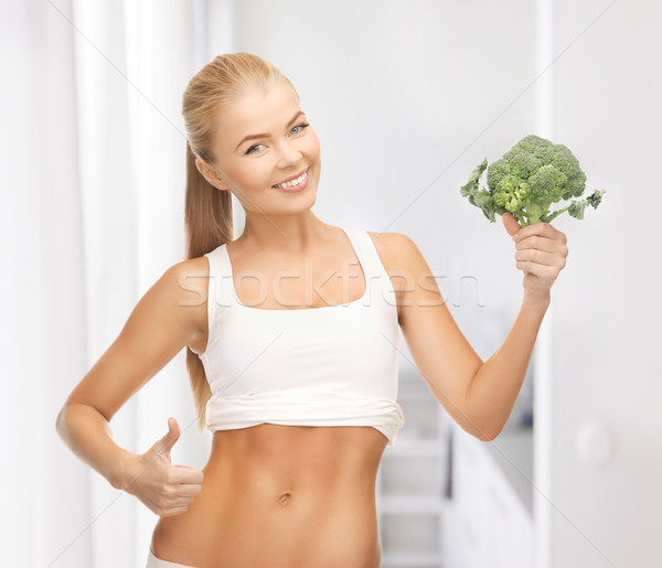 Femme pointant brocoli belle femme alimentaire [[stock_photo]] © dolgachov