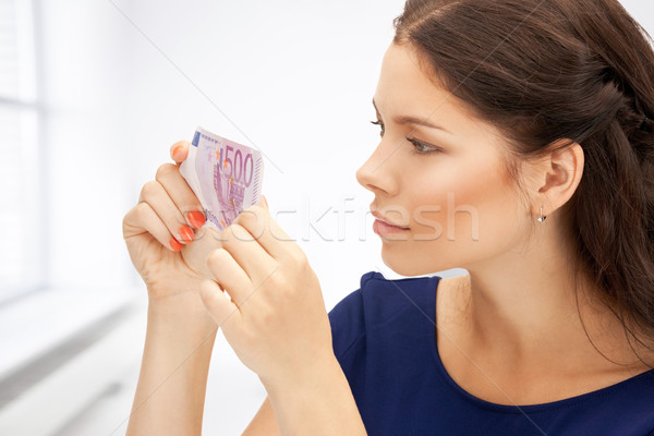 Stock photo: lovely woman with euro cash money