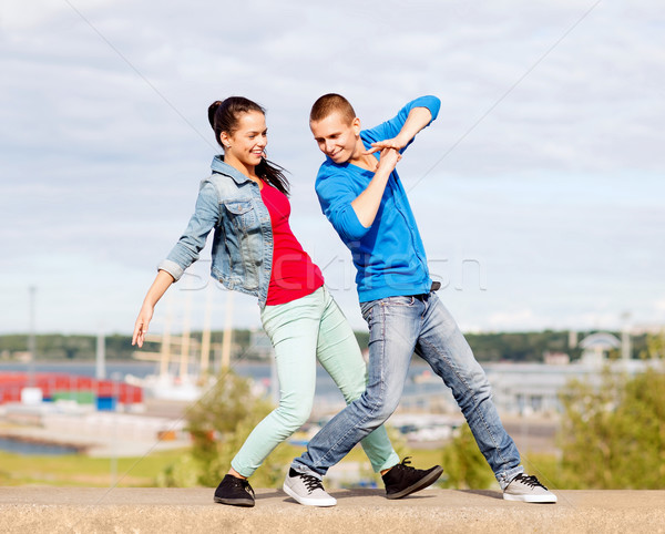 couple of teenagers dancing outside Stock photo © dolgachov