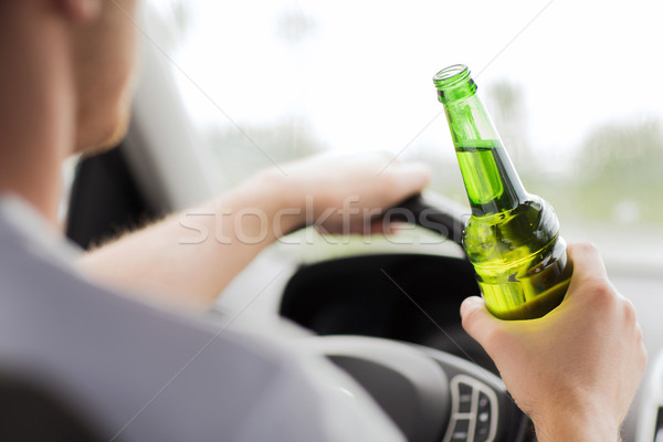 man drinking alcohol while driving the car Stock photo © dolgachov