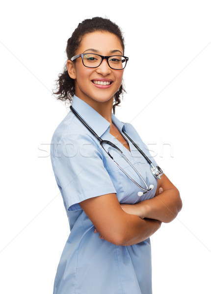 Mosolyog női afroamerikai orvos nővér egészségügy Stock fotó © dolgachov