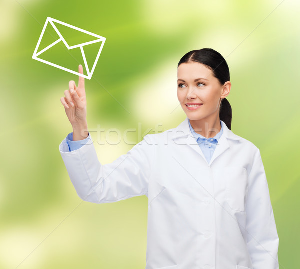 Foto stock: Sonriendo · femenino · médico · senalando · dotación · salud