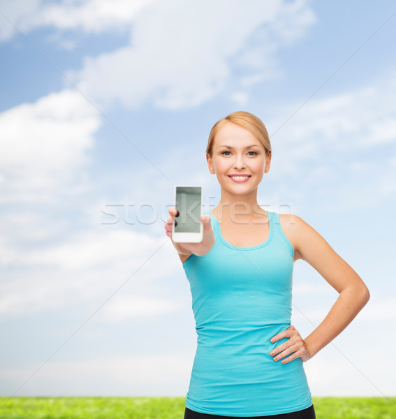 Stock photo: sporty woman with smartphone