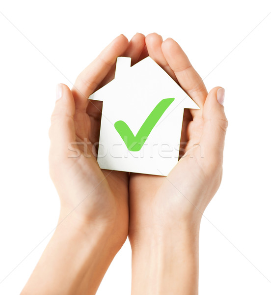 Stock photo: hands holding house with check mark