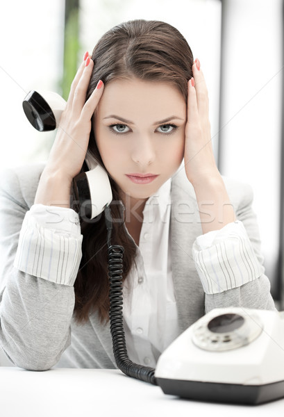 stressed and tired businesswoman with cell phone Stock photo © dolgachov