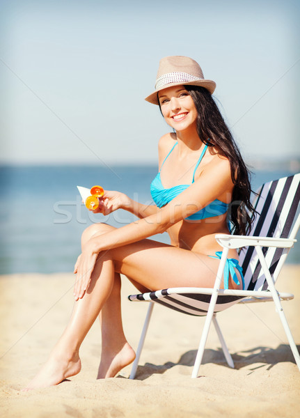 girl sunbathing on the beach chair Stock photo © dolgachov