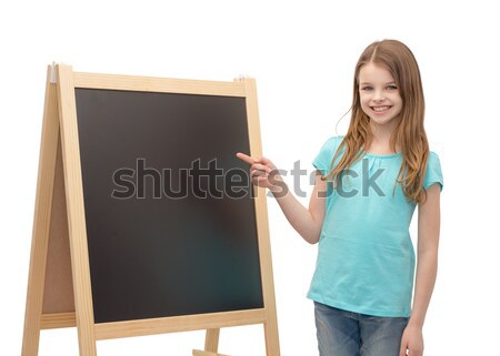 Stockfoto: Gelukkig · meisje · wijzend · vinger · Blackboard · mensen