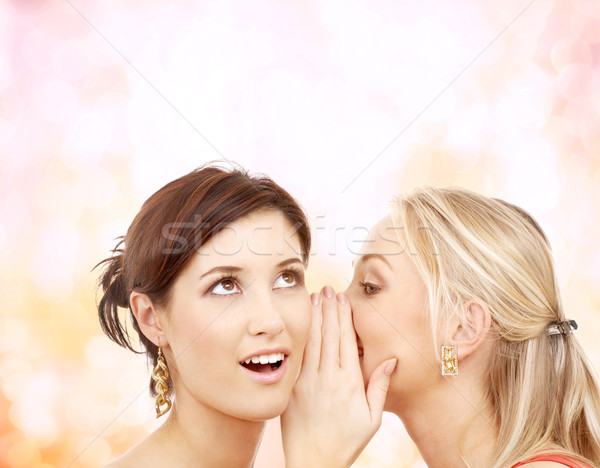 Deux souriant femmes chuchotement potins amitié [[stock_photo]] © dolgachov