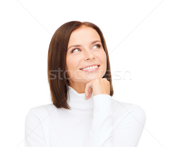 thinking and smiling woman in white sweater Stock photo © dolgachov