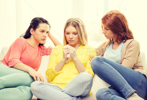 two teenage girls comforting another after breakup Stock photo © dolgachov