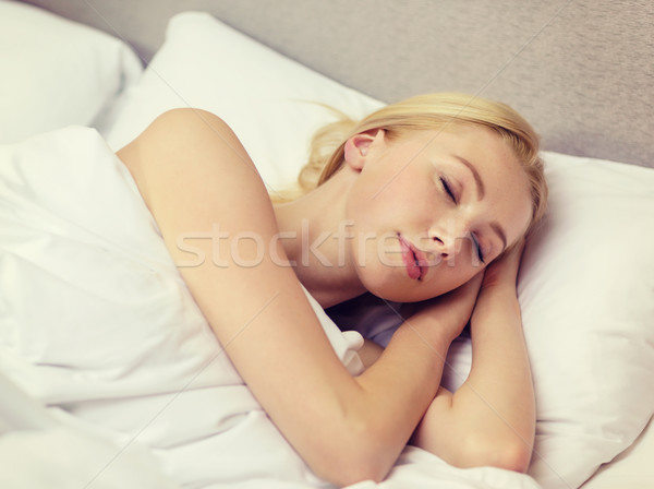 beautiful woman sleeping in bed Stock photo © dolgachov
