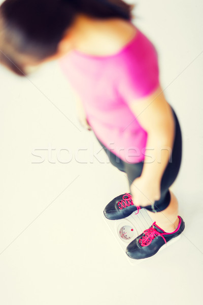 woman legs standing on scales Stock photo © dolgachov