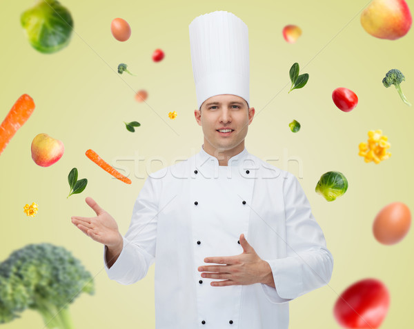 happy male chef cook inviting Stock photo © dolgachov