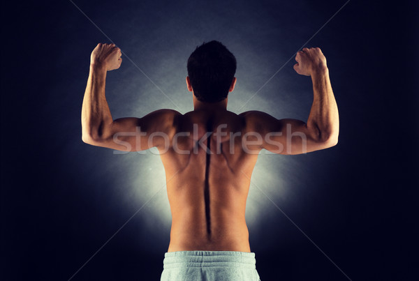 young male bodybuilder from back Stock photo © dolgachov