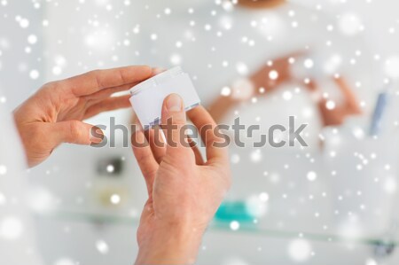close up of male gay couple hands giving condom Stock photo © dolgachov