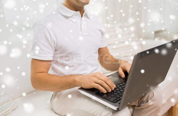 close up of man working with laptop at home Stock photo © dolgachov