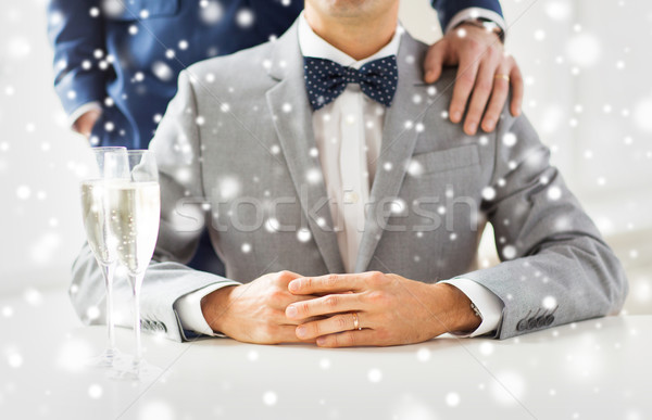 close up of male gay couple with champagne glasses Stock photo © dolgachov