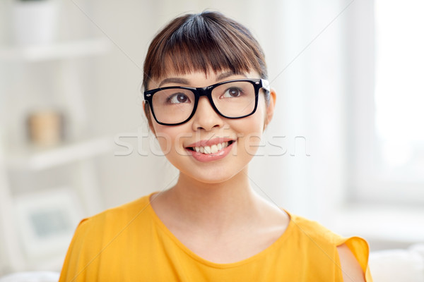 Boldog ázsiai fiatal nő szemüveg otthon emberek Stock fotó © dolgachov