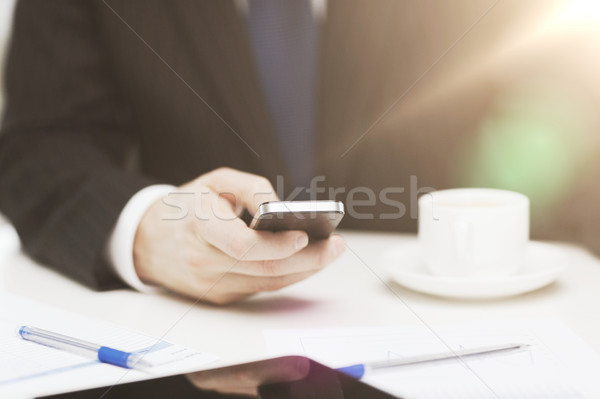 businessman with smartphone reading news Stock photo © dolgachov