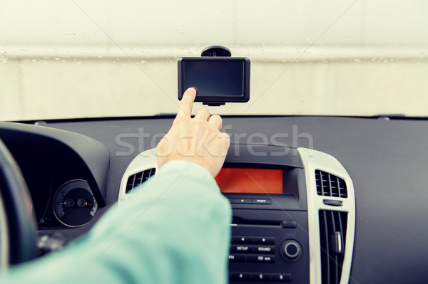 close up of man with gps navigator driving car Stock photo © dolgachov