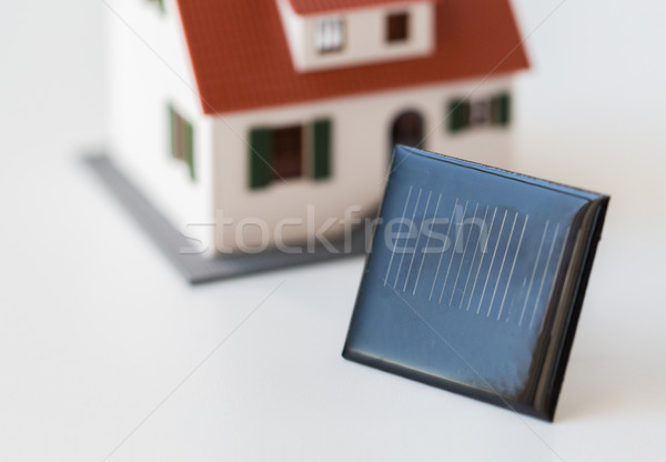 close up of house model and solar battery or cell Stock photo © dolgachov