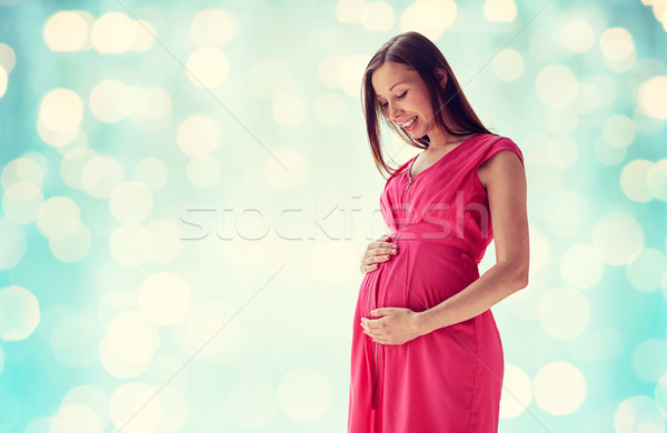 Stock photo: happy pregnant woman with big tummy