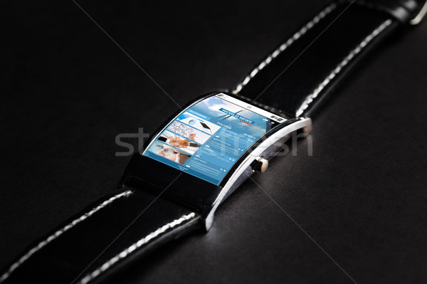 close up of smart watch with business news Stock photo © dolgachov