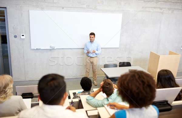 group of students and teacher at lecture Stock photo © dolgachov