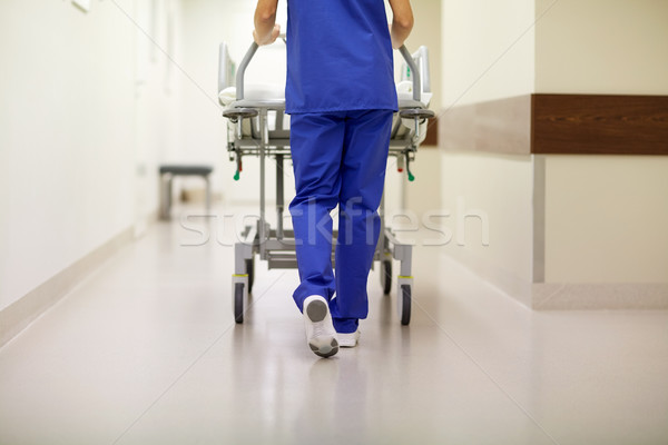 nurse carrying hospital gurney to emergency room Stock photo © dolgachov