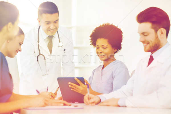 group of happy doctors meeting at hospital office Stock photo © dolgachov