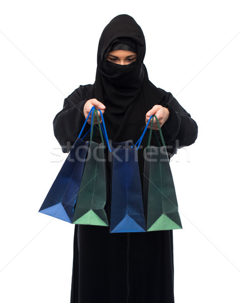 muslim woman in hijab with shopping bags Stock photo © dolgachov