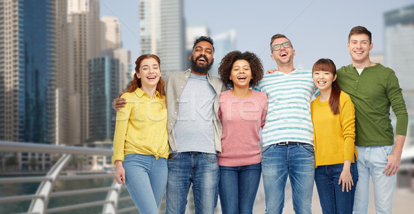 international group of happy people in dubai Stock photo © dolgachov