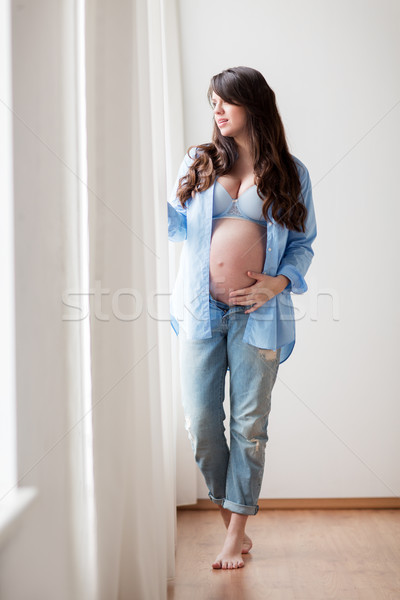 Boldog terhes nő nagy pocak otthon terhesség Stock fotó © dolgachov
