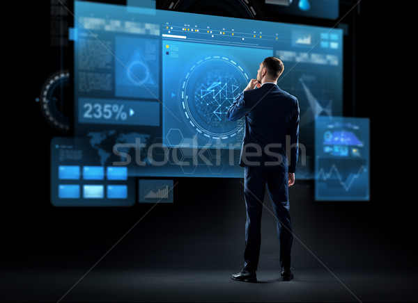 businessman looking at virtual screen from back Stock photo © dolgachov