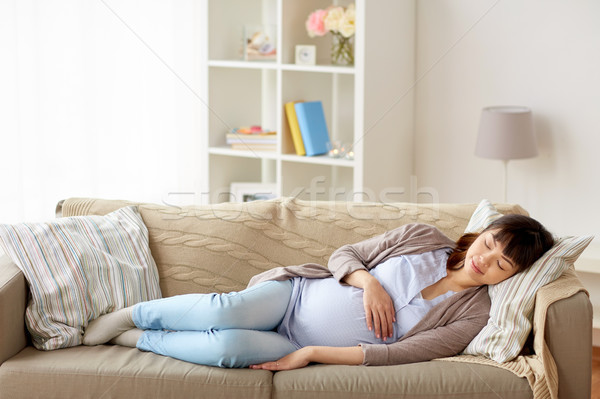 Stockfoto: Gelukkig · zwangere · vrouw · slapen · sofa · home · zwangerschap