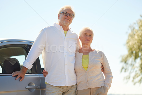 happy senior couple hugging at car in summer Stock photo © dolgachov