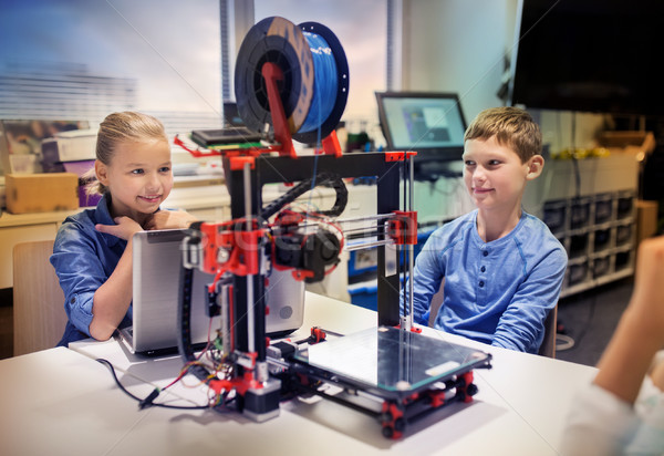 Stock photo: happy children with 3d printer at robotics school