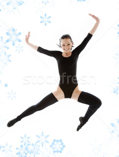 jumping girl in black leotard Stock photo © dolgachov