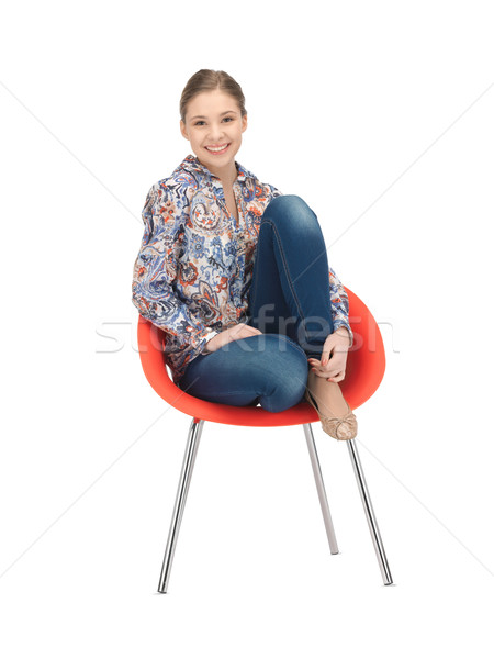 happy and carefree teenage girl in chair Stock photo © dolgachov
