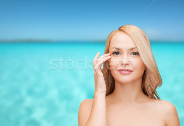 beautiful woman touching her eye area Stock photo © dolgachov