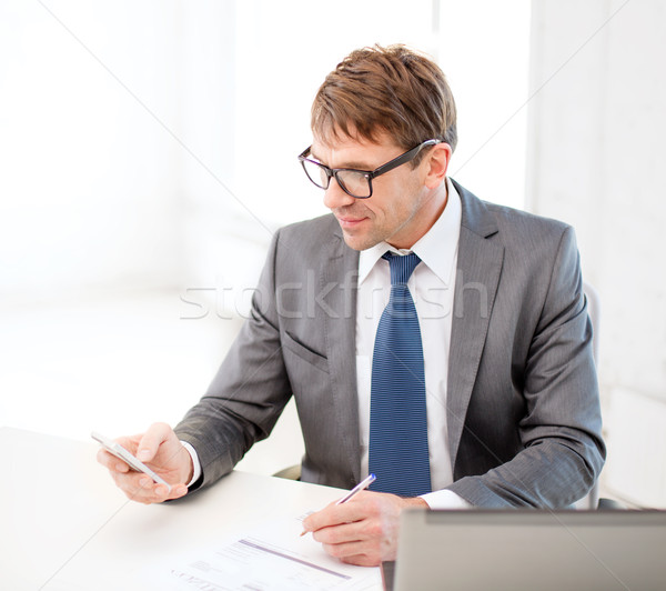 businessman working with laptop and smartphone Stock photo © dolgachov