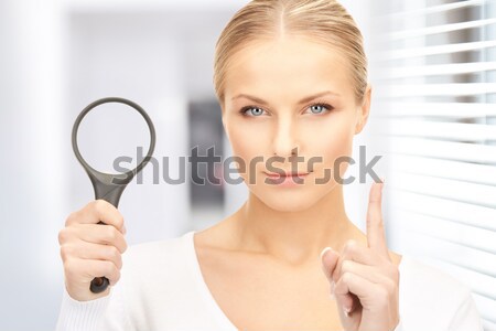 smiling woman looking at mirror Stock photo © dolgachov