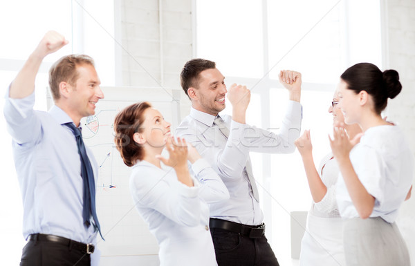 business team celebrating victory in office Stock photo © dolgachov