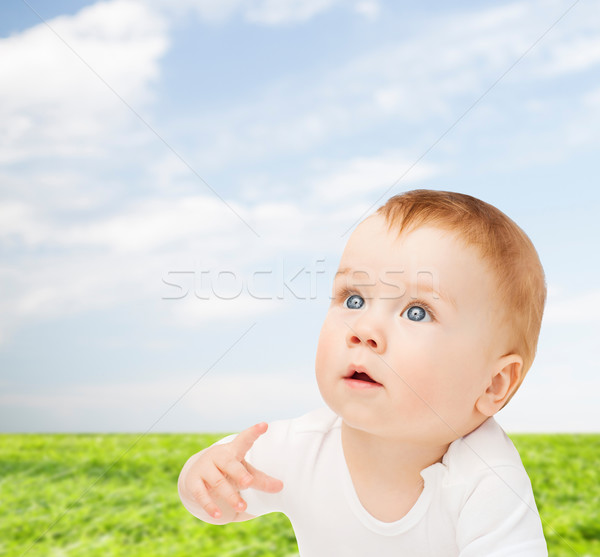 curious baby lying on floor and looking up Stock photo © dolgachov